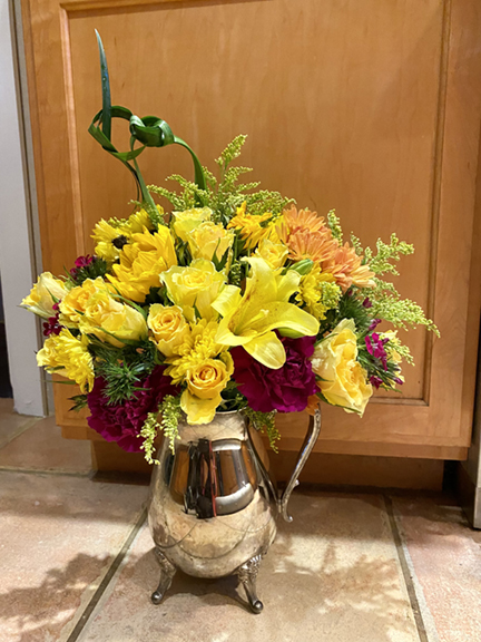Thanksgiving flower arrangement by Bella